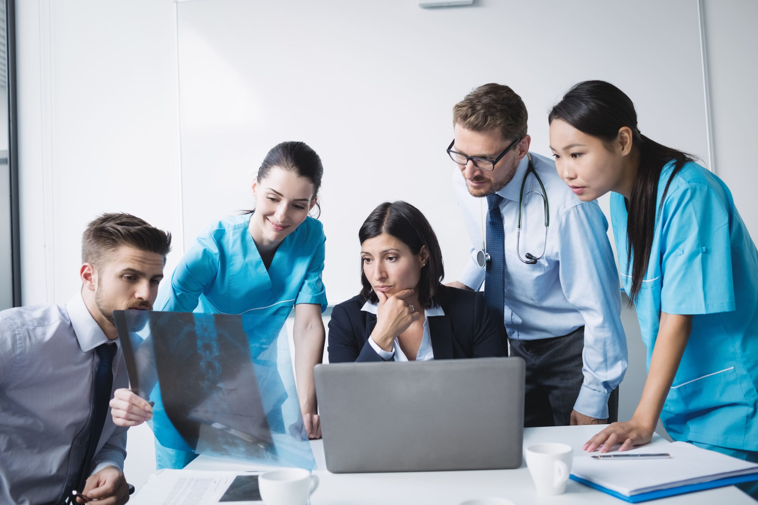 Healthcare scholars reviewing medical data for AI sourcing.