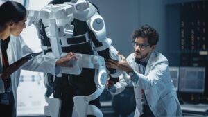 Engineers calibrating a robot in a research lab.