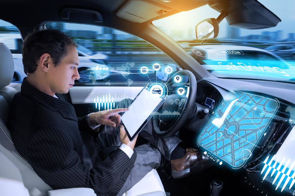 Caucasian man riding autonomous car