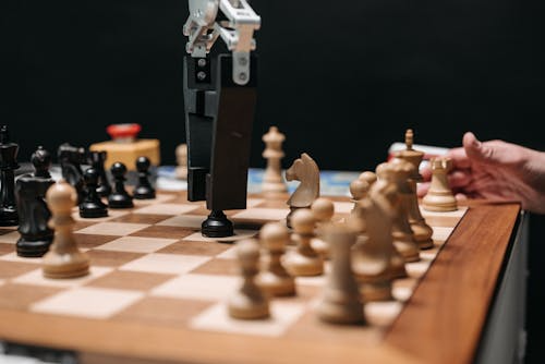 Robot moving a pawn on a chessboard