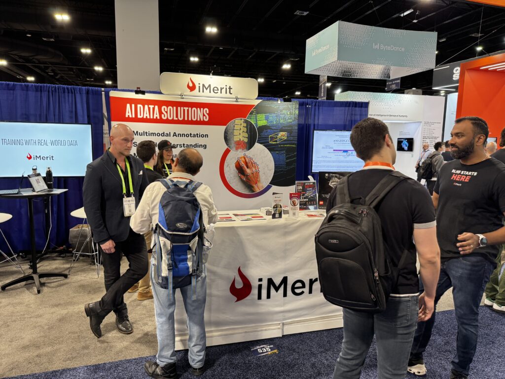 Our team speaks with attendees at the booth