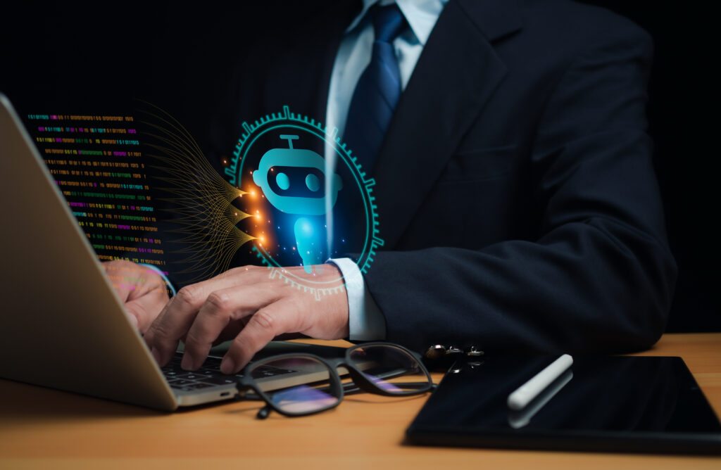 Business professional using a laptop with an AI chatbot interface and digital code visualization.